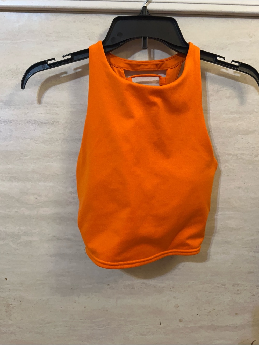 Alo Yoga Vixen Crop Tank in a bright orange shade